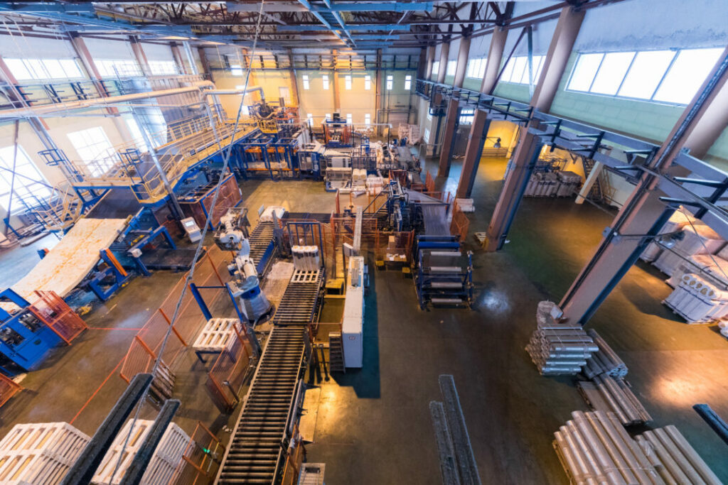 Top view of modern operational plant producing fiberglass heavy industry machinery metalworking workshop concept.